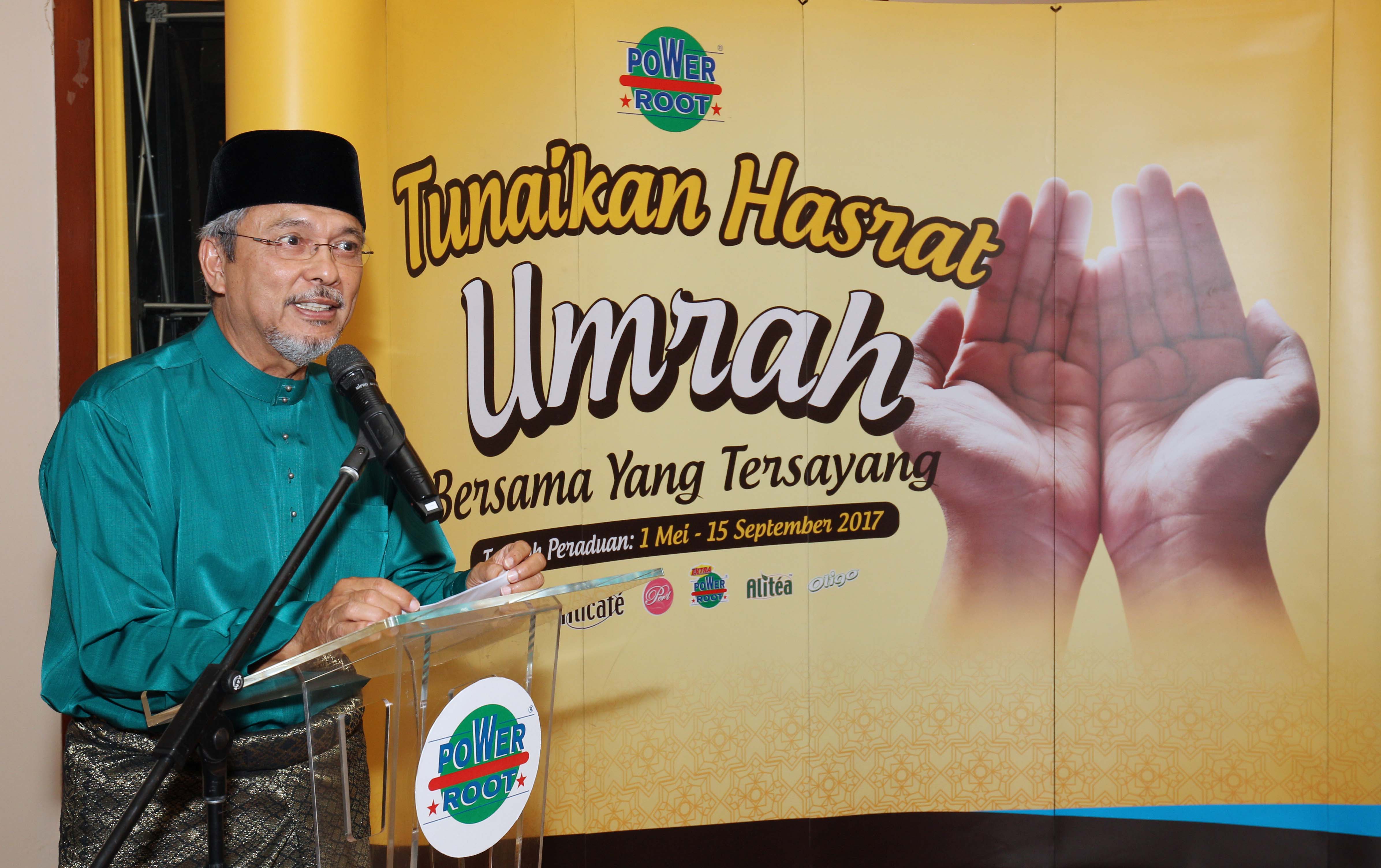 Power Root Chairman Dato' Afifuddin Bin Abdul Kadir giving his peech at the Power Root Tunaikan Hasrat Umrah prize giving ceremony.
