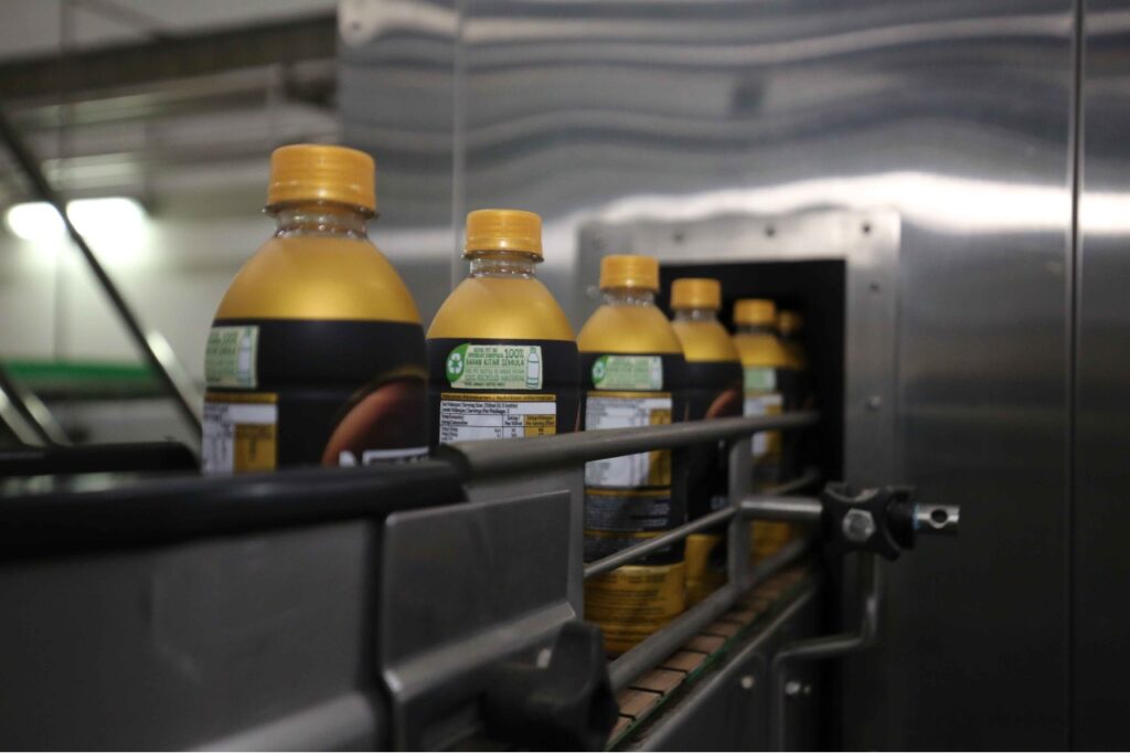 Production line of Nestlé Malaysia's 100% rPET bottles for its Ready-to-Drink products at Nestlé's Sri Muda Factory. - Kitar Semula